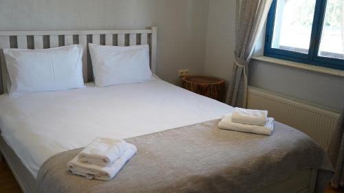 Una cama o camas en una habitación de Hotel Kazak Club