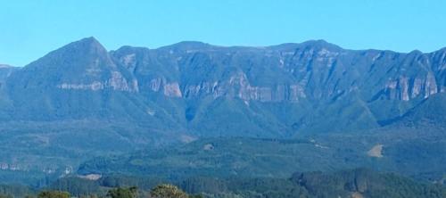 a view of a mountain range with trees in the foreground at Cabana in Annitapolis