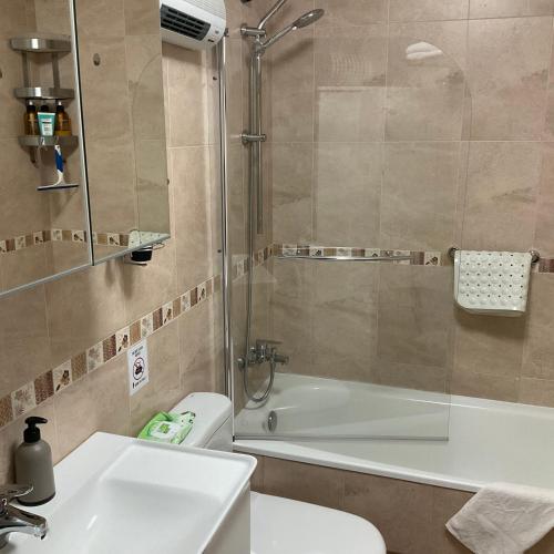 a bathroom with a shower and a toilet and a sink at Ávila Apartment - Full Centric Flat with Amazing Views in Negreira