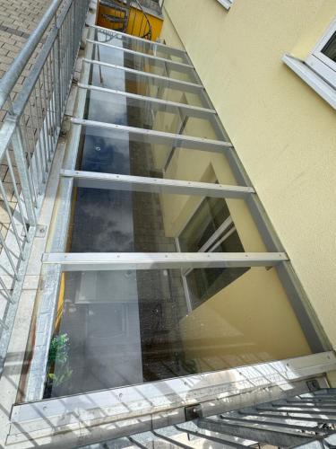 an empty stairwell of a building with a window at Pension Chen in Griesstätt