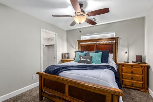 a bedroom with a bed and a ceiling fan at Harrison Chandler in Chandler