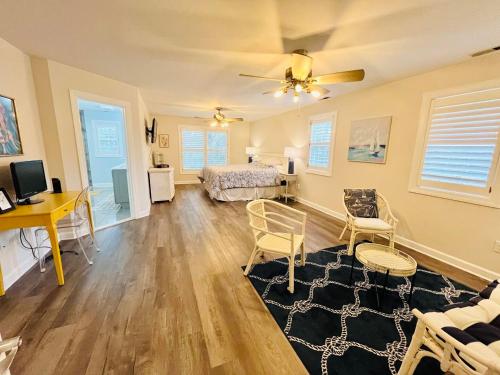 a living room with a bed and a desk at Port royal road 25 in Ocean View