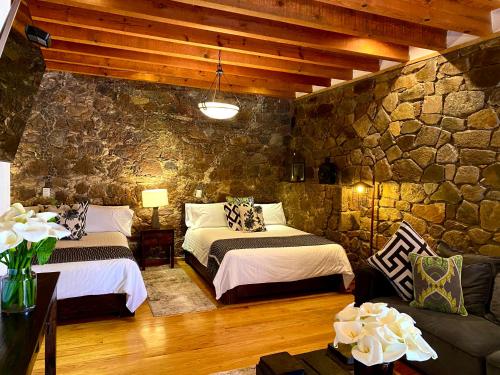 Postel nebo postele na pokoji v ubytování HOTEL MINA REAL