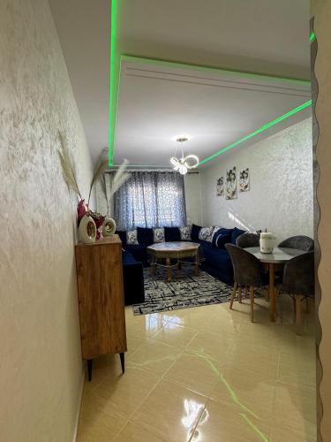a living room with a couch and a table at Comfort Airport House 3min To Airport air-conditioned rooms in Tangier