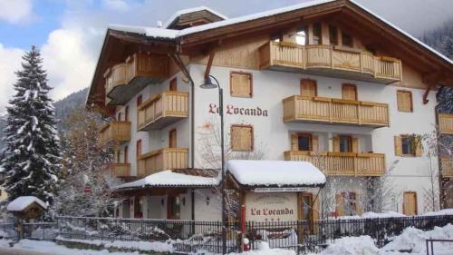 a hotel in the mountains with snow on the ground at Apartments in Giustino di Pinzolo 23481 in Giustino