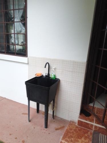 a black sink in the corner of a bathroom at Luxury apartmеnt with private terrace in Altos del Maria in Sorá