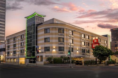 a building on the corner of a street at Best Western Plus LA Mid-Town Hotel in Los Angeles