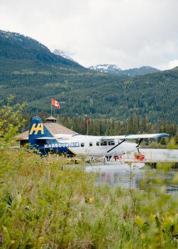 an airplane parked on the runway at an airport at Four Seasons Resort Whistler in Whistler