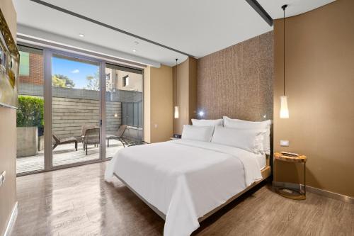 Postel nebo postele na pokoji v ubytování BOG Hotel
