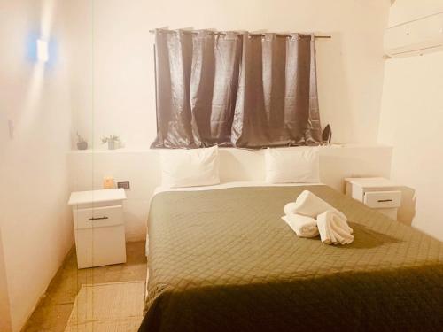 Postel nebo postele na pokoji v ubytování Hotel Casa Pierretta