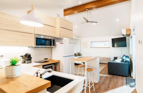 a kitchen with a sink and a counter top at Upscale Laneway Loft Near Downtown AC WiFi in Calgary