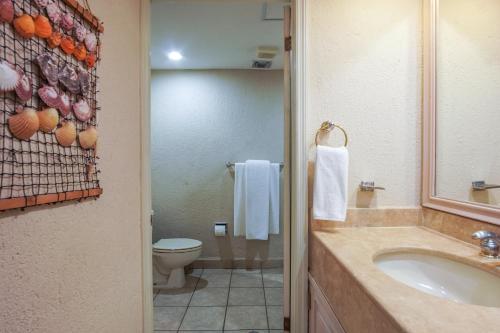 a bathroom with a sink and a toilet at Princesa De Penasco in Punta Penasco New