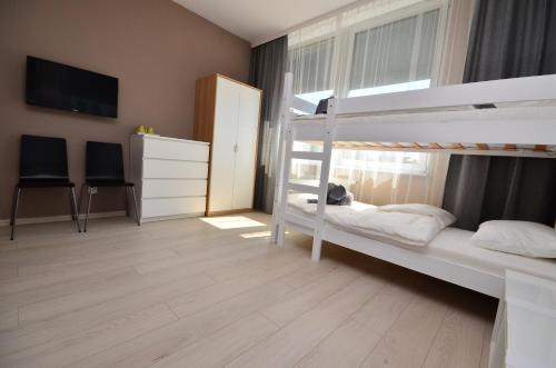 Postel nebo postele na pokoji v ubytování G'HOSTEL