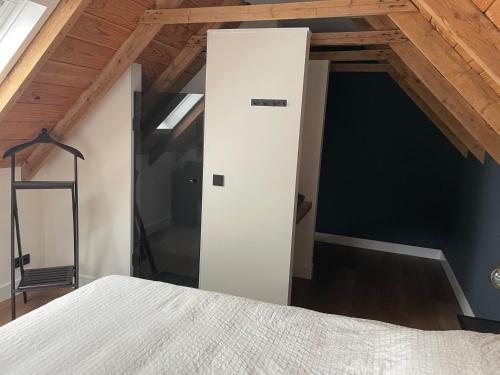 Ένα ή περισσότερα κρεβάτια σε δωμάτιο στο B&B De Koningsbeek