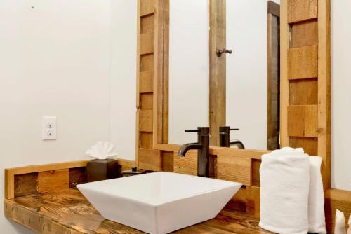 a bathroom with a white sink and a mirror at Village chic chalet #2113 in Big Bear Lake