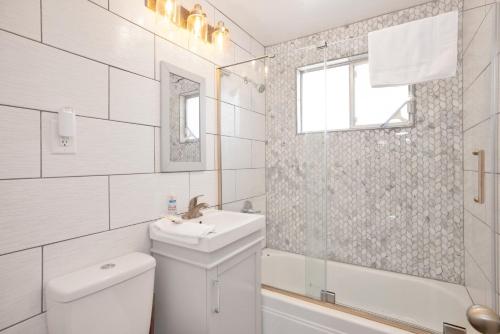 a white bathroom with a sink and a toilet at Storyville #2294 in Big Bear Lake
