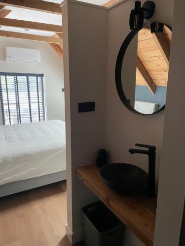 Ένα ή περισσότερα κρεβάτια σε δωμάτιο στο B&B De Koningsbeek