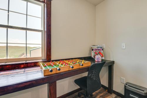 a room with a desk with a game on it at Pet Friendly Daydreamers Guest Ranch on 60 Acres in Lingle