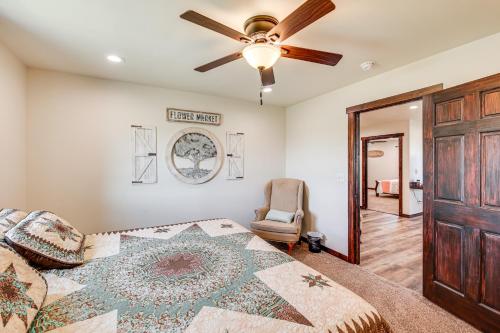 a bedroom with a bed and a ceiling fan at Pet Friendly Daydreamers Guest Ranch on 60 Acres in Lingle
