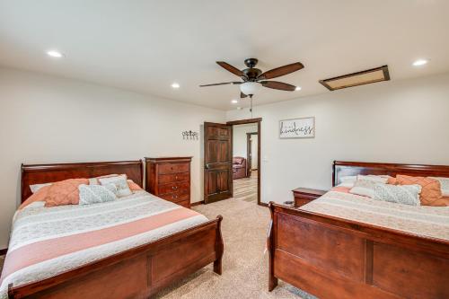 a bedroom with two beds and a ceiling fan at Pet Friendly Daydreamers Guest Ranch on 60 Acres in Lingle