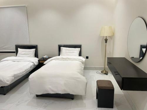 Een bed of bedden in een kamer bij أركان نموذجية