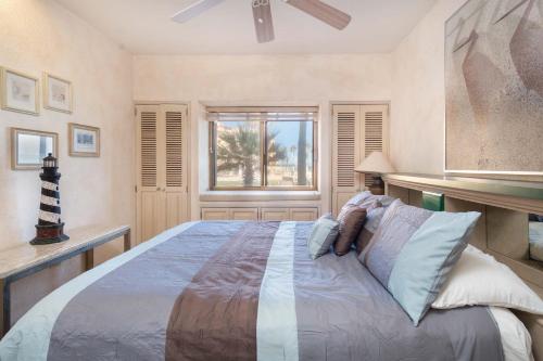 a bedroom with a large bed and a window at Princesa De Penasco in Punta Penasco New
