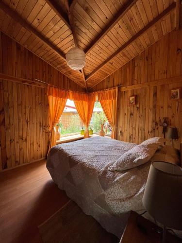 Postel nebo postele na pokoji v ubytování Cabaña Las Patagüas - Coñaripe