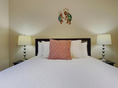 a bedroom with a white bed with two lamps at Southern #3116 Mesa in Mesa