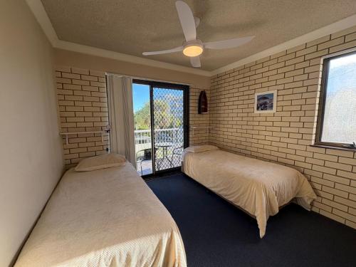 Ένα ή περισσότερα κρεβάτια σε δωμάτιο στο White Opal Unit 4