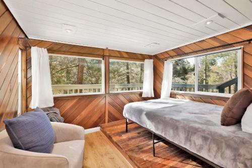 a room with a bed and two chairs in it at Conklin paradise #1993 in Big Bear Lake