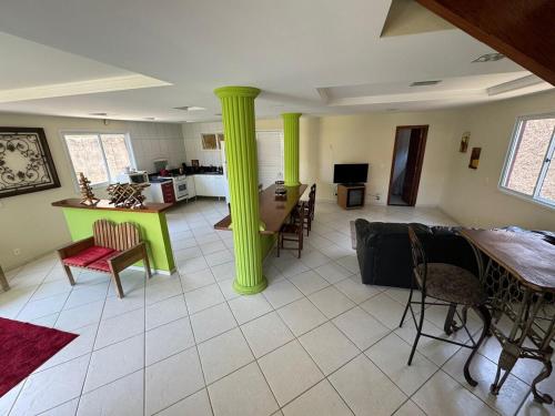 Ένα ή περισσότερα κρεβάτια σε δωμάτιο στο Casa de Praia Bicanga com SPA