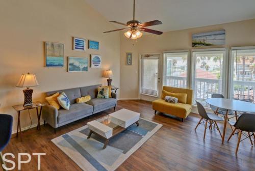 a living room with a couch and a table at Gulfpoint 1302 in South Padre Island