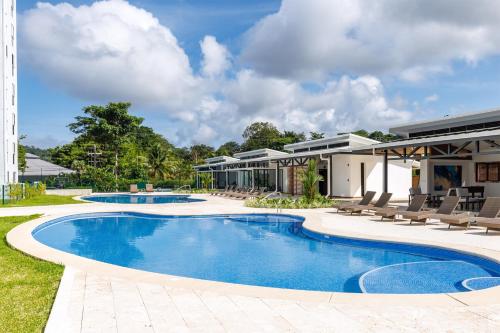 a swimming pool in the backyard of a house at Viva Jaco II in Jacó