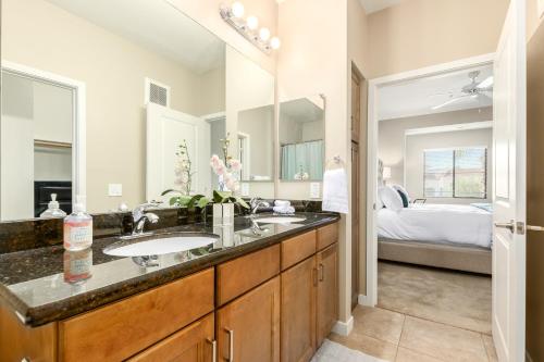 a bathroom with a sink and a large mirror at Queen Creek #139 Chandler in Chandler