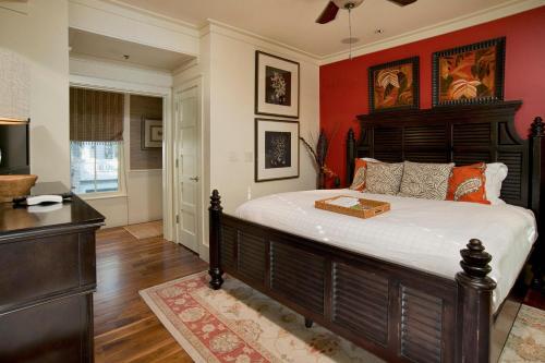 a bedroom with a large bed with a wooden headboard at River View 3 Bedroom Wilson Village Home 70 in Bluffton