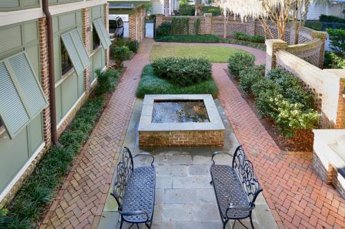 a patio with two chairs and a fountain at River View 3 Bedroom Wilson Village Home 70 in Bluffton