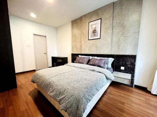 a bedroom with a large bed in a room at Blissful Homes at i-City - WiFi TV Box 1 Carpark in Shah Alam