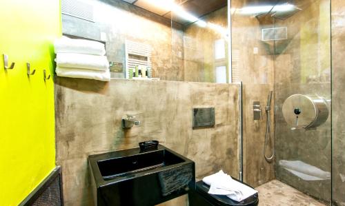 a bathroom with a sink and a shower at Czech Inn in Prague