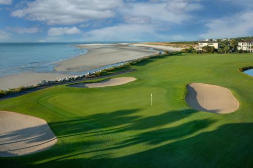 an aerial view of a golf course with the ocean at 521 Sunsuite in Fripp Island