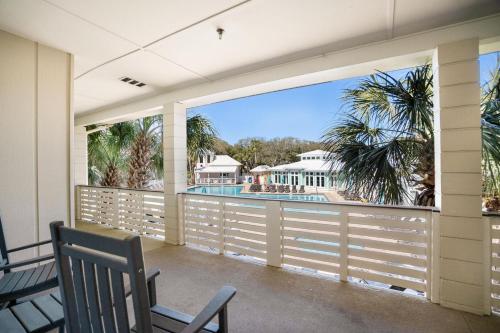 a balcony with a view of a swimming pool at 521 Sunsuite in Fripp Island