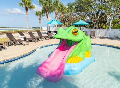 a inflatable frog in a pool at a resort at Sprawling Family Home w/ Pool Table - Steps from Beach, Tennis, & Pools in Fripp Island