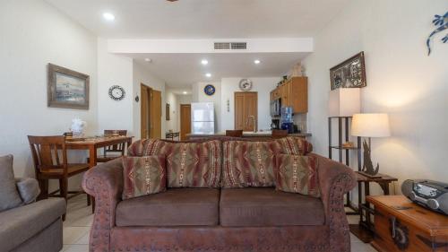 a living room with a couch and a table at Laughing Seagull Lovely Oceanfront Condo in Puerto Peñasco