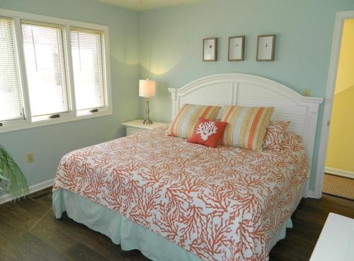 a bedroom with a bed with two pillows on it at Swedes street 201 in Dewey Beach