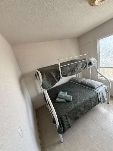 a bedroom with a bunk bed in a room at Aldea Aqua - HiveNB in Tlayecac