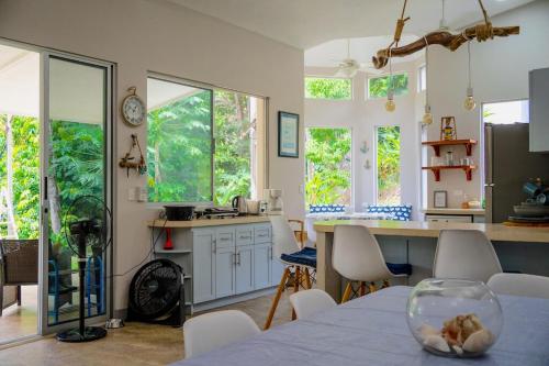 a kitchen with a table with a bowl on it at Casa Ballena with Beach Access and Private Pool in Uvita