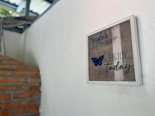 a picture of a butterfly hanging on a wall at Casa Ballena with Beach Access and Private Pool in Uvita