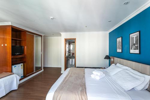 Postel nebo postele na pokoji v ubytování Hotel bourbon residente
