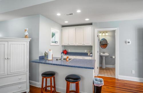 a kitchen with white cabinets and a blue counter top at Tasteful 2 Story 4 Bedroom, 4 Bath Home! New on Rental Program, Sleeps 12! in Fripp Island