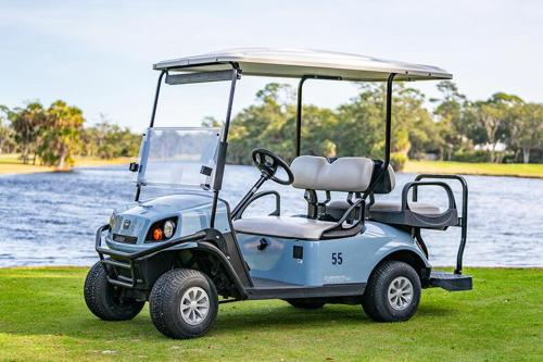 a golf cart parked on the grass near the water at Tasteful 2 Story 4 Bedroom, 4 Bath Home! New on Rental Program, Sleeps 12! in Fripp Island