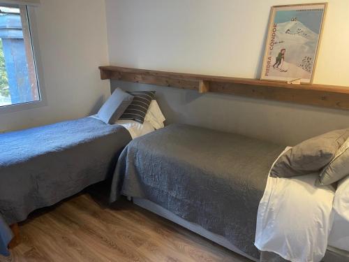 Postel nebo postele na pokoji v ubytování La Pampita en Villa Arelauquen